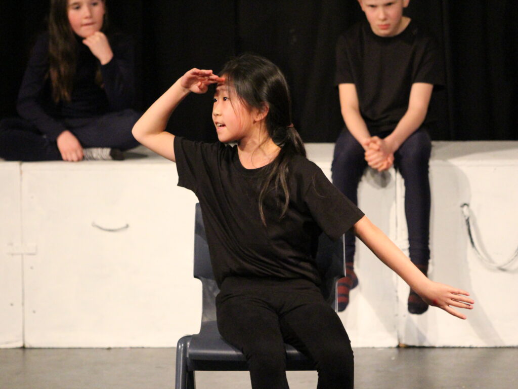 student in an acting performance