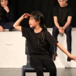 student in an acting performance